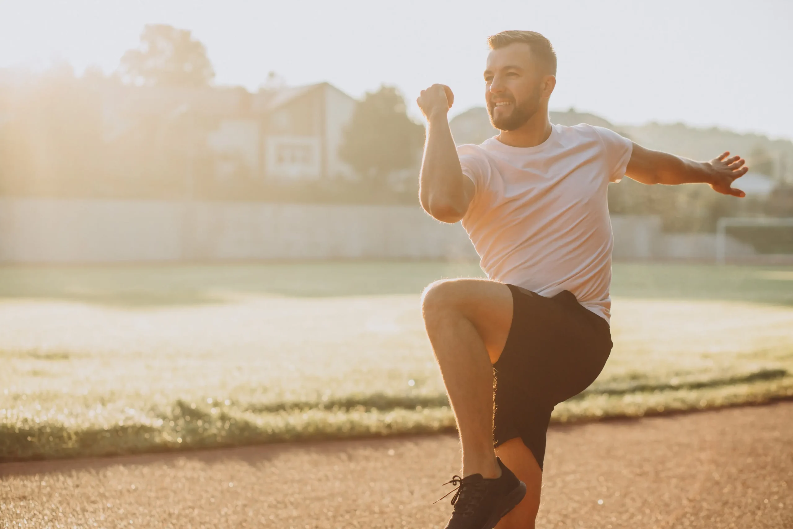 man-stretching-before-workout-stadium