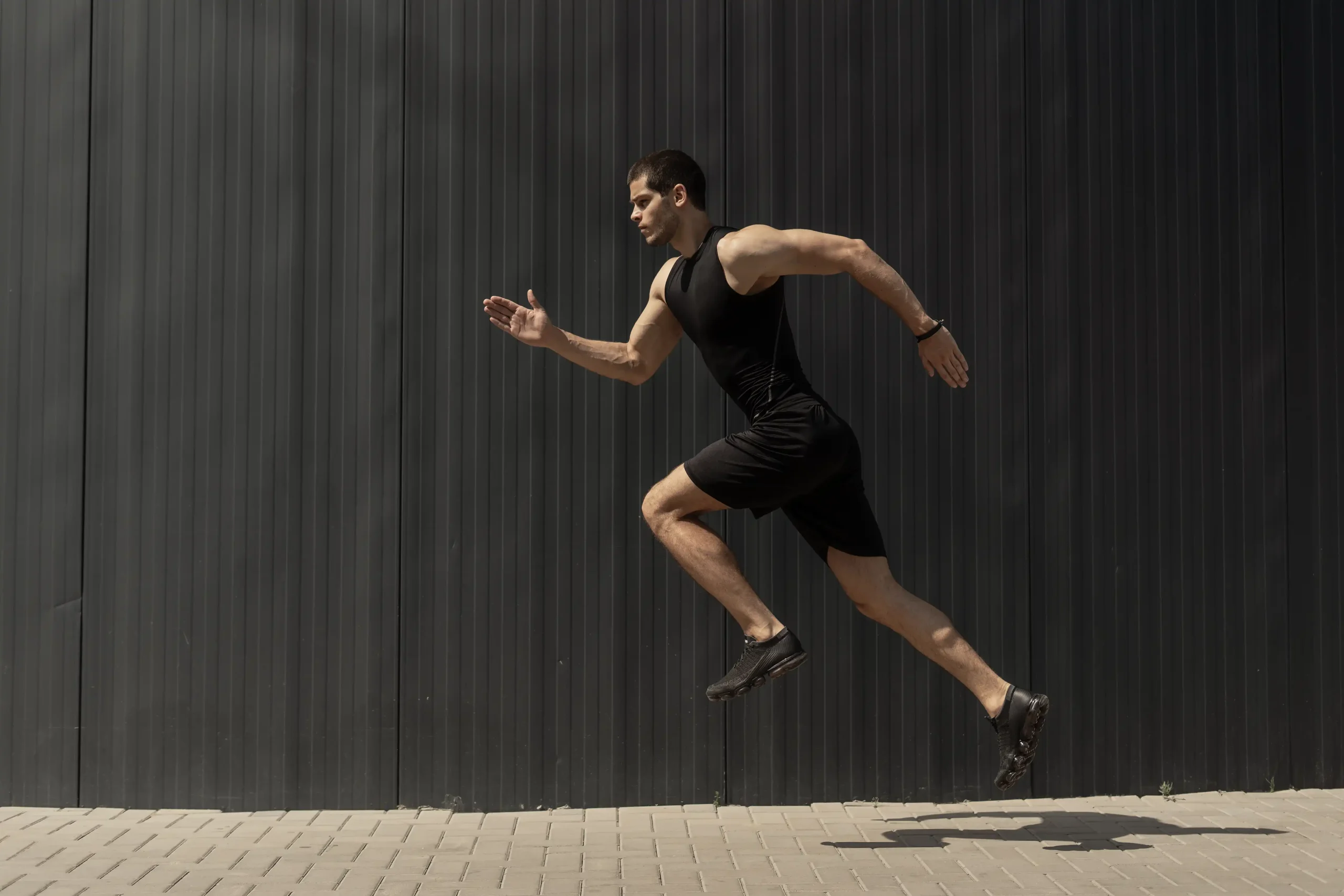 side-view-shot-fit-young-athletic-man-jumping-running