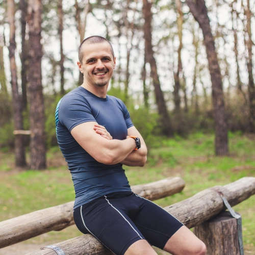 a middle age man seat on a tree