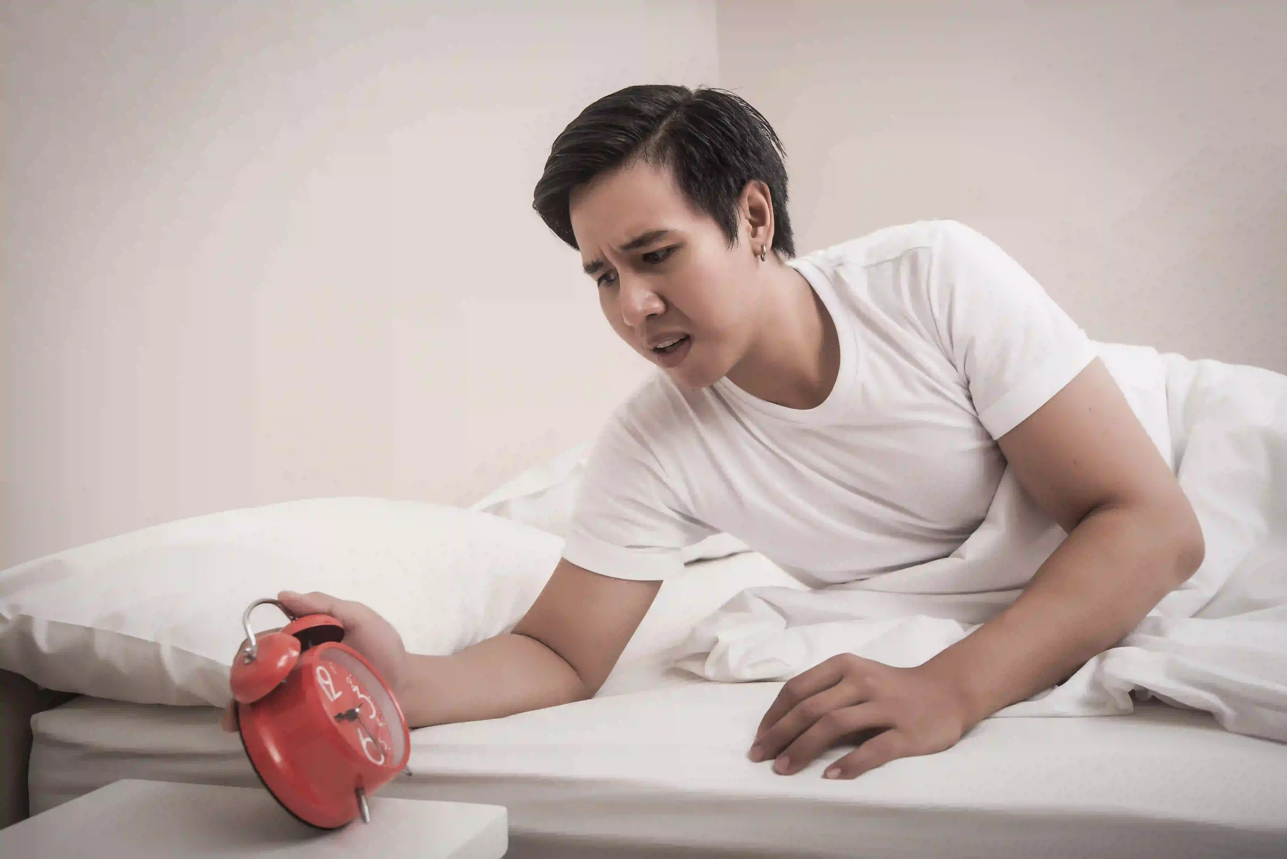 man-hand-turns-off-alarm-clock-hurry-waking-up-morning image
