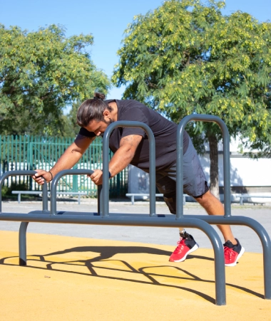 sporty-man-with-disability-developing-his-health-stadium-young-man-with-muscles-training-his-hands-bars-ground-motivation-sport-active-life-people-with-disability-concept